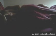 Spanish couple having foreplay in bed